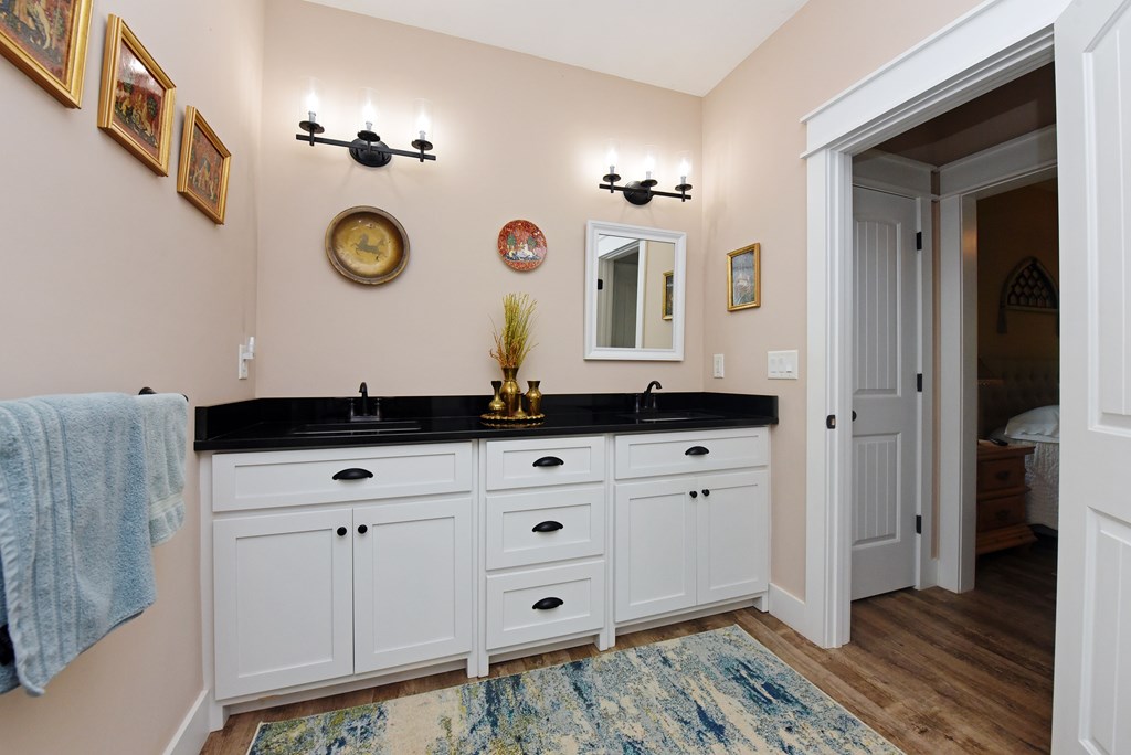 83 Highland Road Blairsville, GA 30512 - Photo 24 of 32 a bathroom with a sink and a mirror