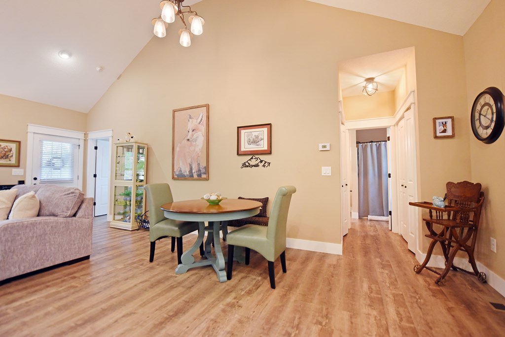 83 Highland Road Blairsville, GA 30512 - Photo 25 of 32 a view of a dining room with furniture and wooden floor