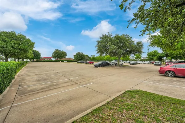 a view of an outdoor space and tennis court