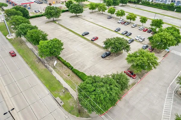 an aerial view of a house with a yard and a garden