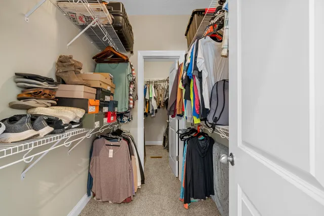 a en suite bathroom with a sink vanity and mirror