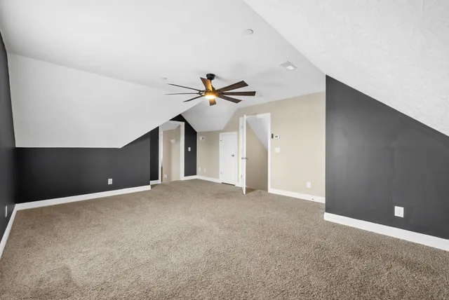 a view of a patio with couches next to a yard