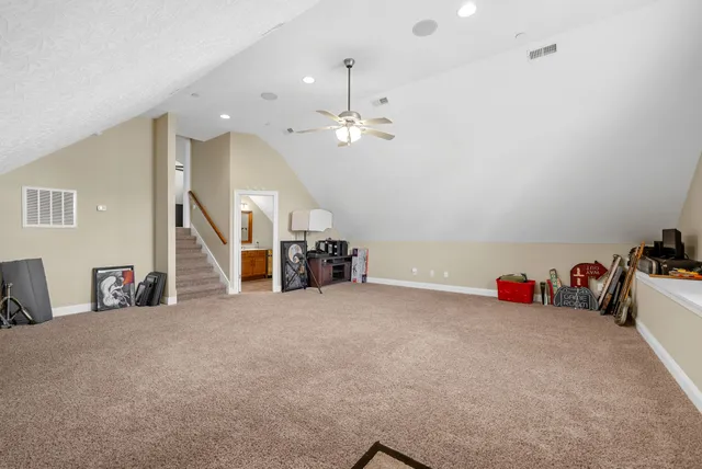 a swimming pool with outdoor seating and yard