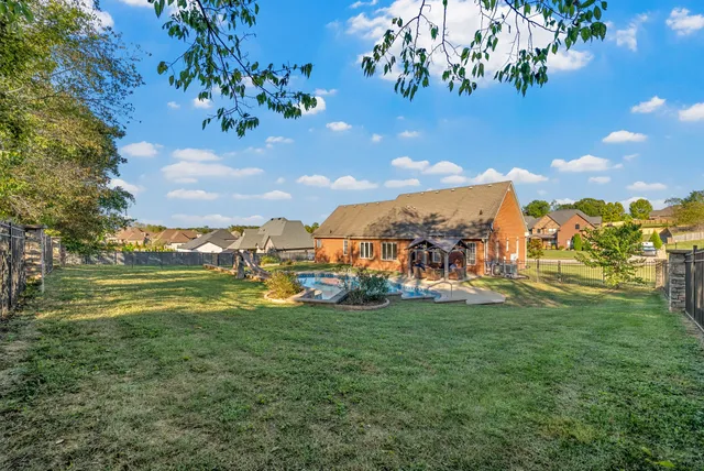 an aerial view of a house with outdoor space