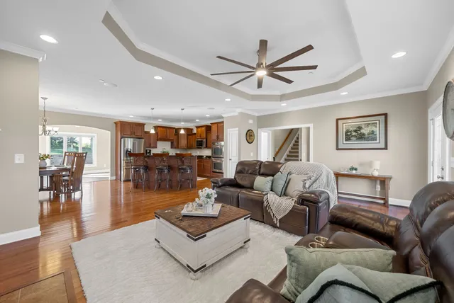 a living room with fireplace furniture and a flat screen tv