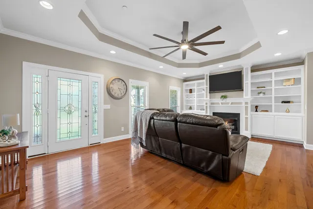 a view of a dining room with furniture and wooden floor