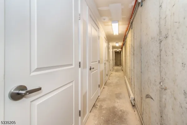 a view of storage and utility room with washer and dryer