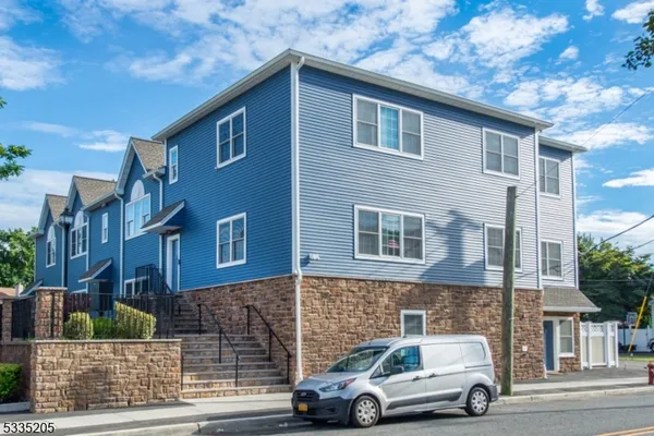 a car parked in front of a brick building
