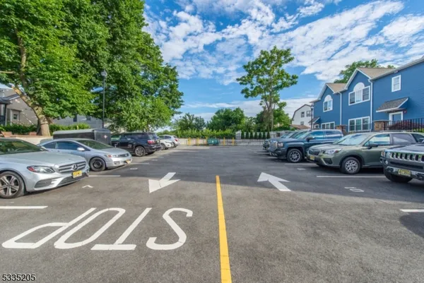 a couple of cars parked in front of a brick building