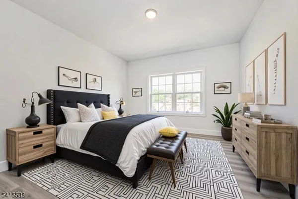 a bed room with bed and windows