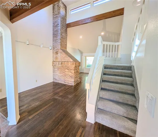 a view of entryway with wooden floor