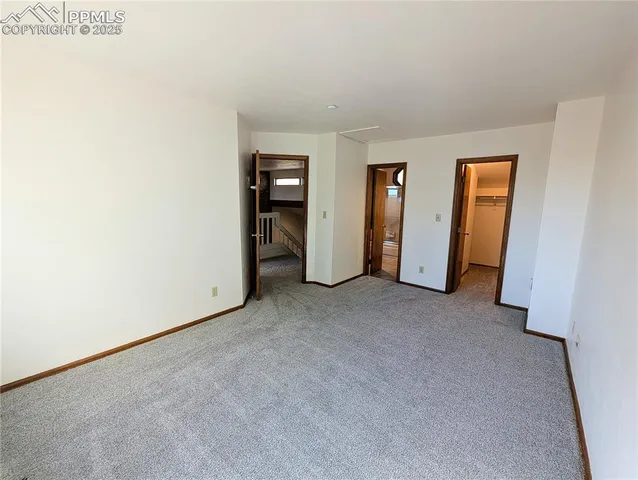 a view of an empty room and closet