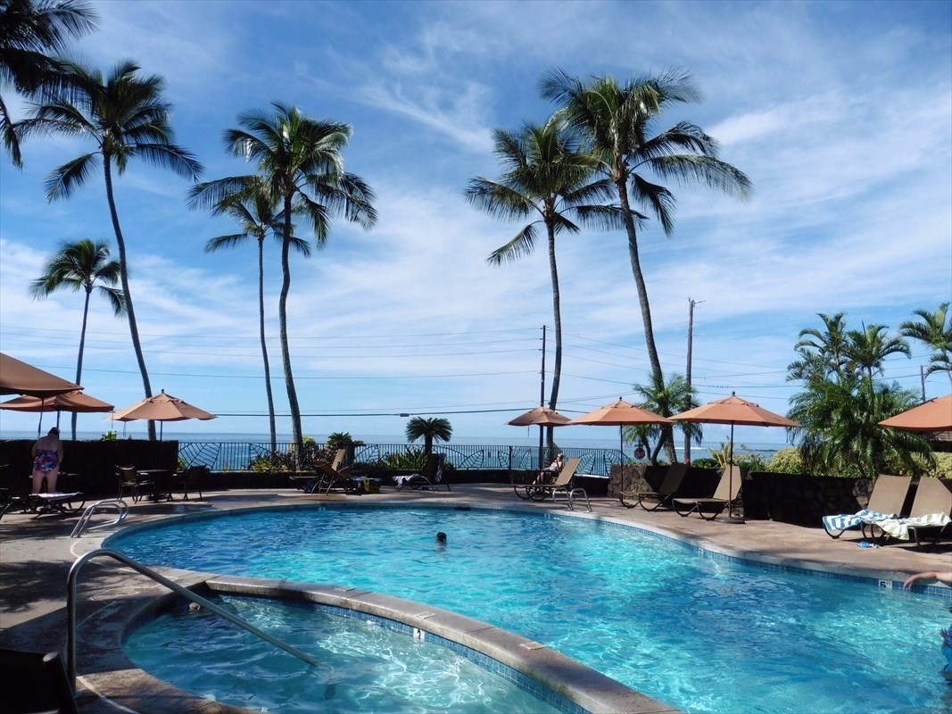 a view of a swimming pool with a chair