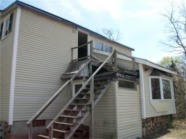 520 Granby Road Chicopee, MA 01013 - Photo 4 of 11 a view of a house with wooden stairs