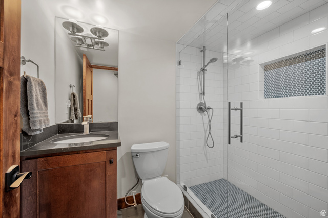 4221 Juniper Circle Alpine, UT 84004 - Photo 33 of 66 Full bathroom featuring a walk-in shower with clear glass enclosure, white subway tile surround, and an integrated tiled niche