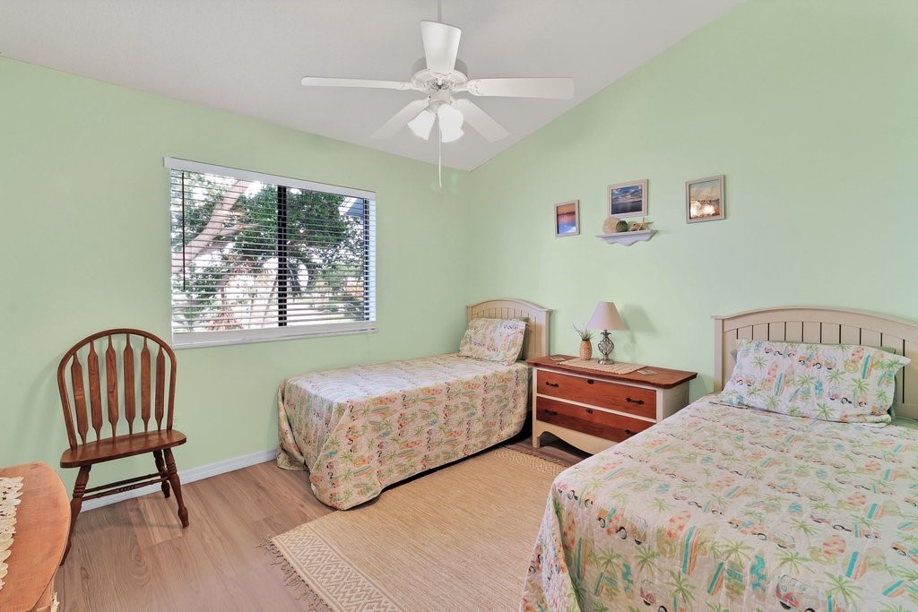 9637 Riverside Drive, Unit 3 Sebastian, FL 32958 - Photo 17 of 36 a bedroom with two beds and a window