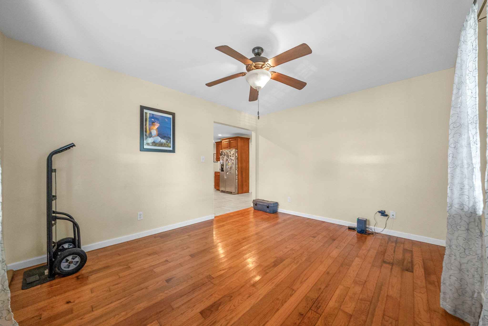 5619 Pembroke-Fairview Road Pembroke, KY 42266 - Photo 13 of 29 a view of a room with wooden floor and a ceiling fan