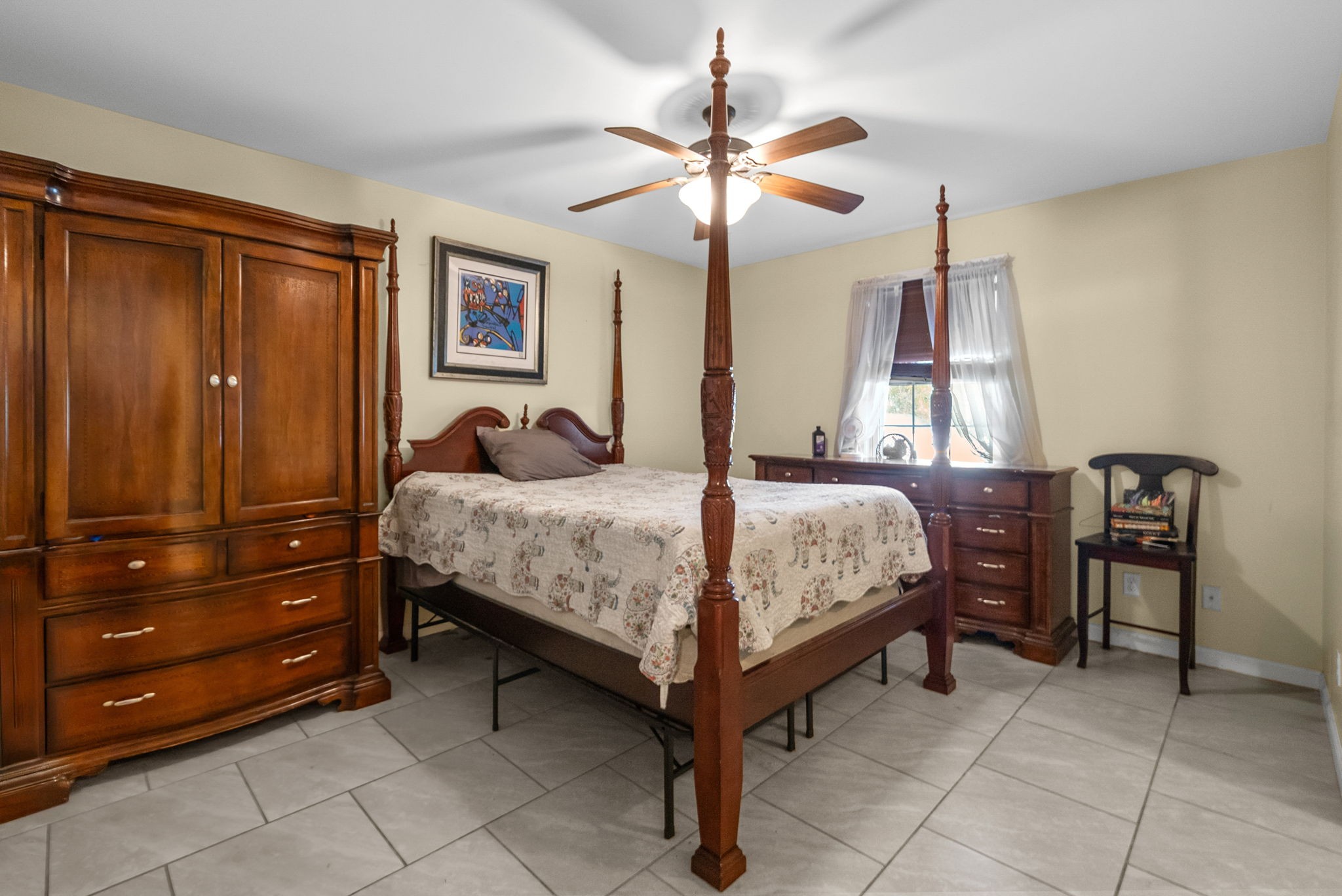 5619 Pembroke-Fairview Road Pembroke, KY 42266 - Photo 15 of 29 a bedroom with a bed and a chandelier