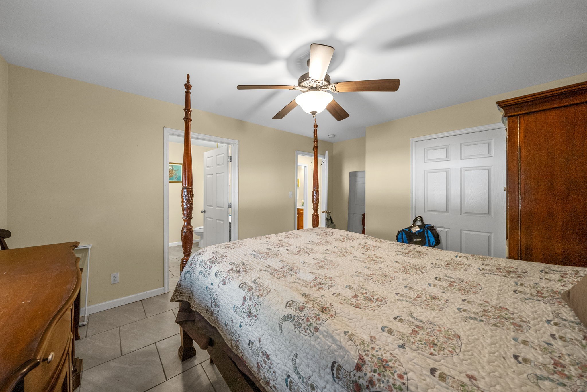 5619 Pembroke-Fairview Road Pembroke, KY 42266 - Photo 16 of 29 a bedroom with a bed and a chandelier