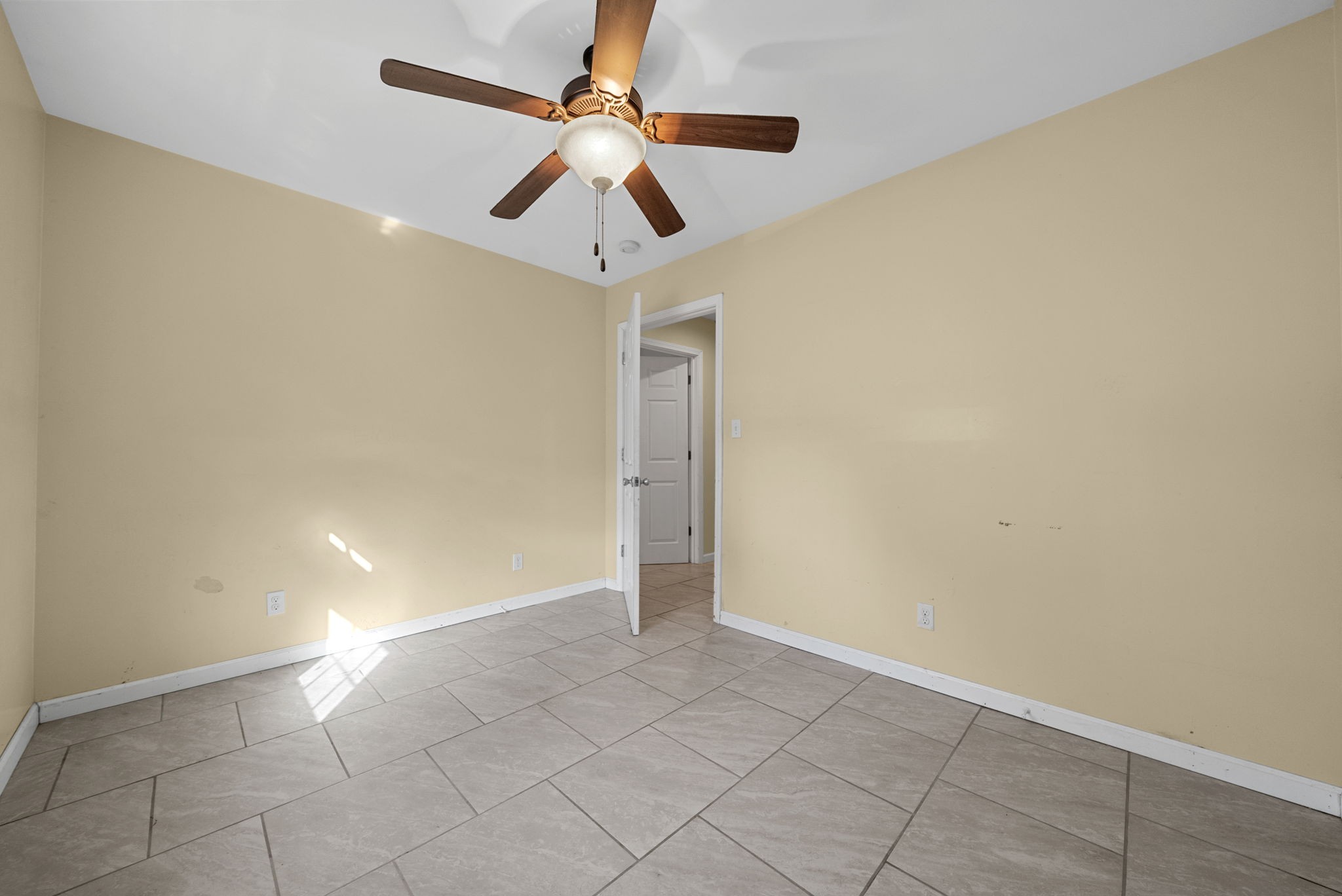 5619 Pembroke-Fairview Road Pembroke, KY 42266 - Photo 22 of 29 an empty room with a ceiling fan and carpet