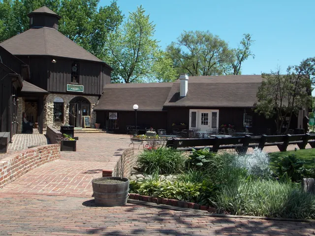 a front view of a house with yard and trees