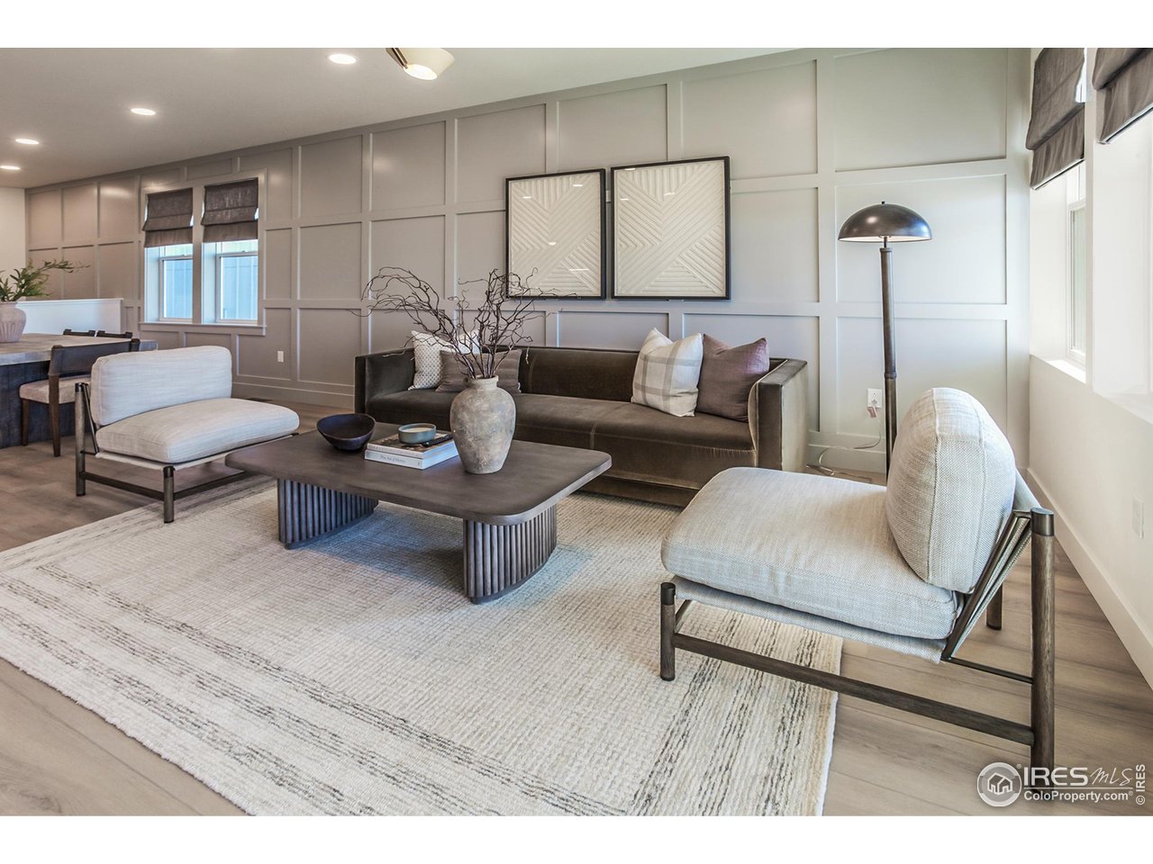 792 Chatter Road Windsor, CO 80550 - Photo 11 of 42 a living room with furniture and a wooden floor