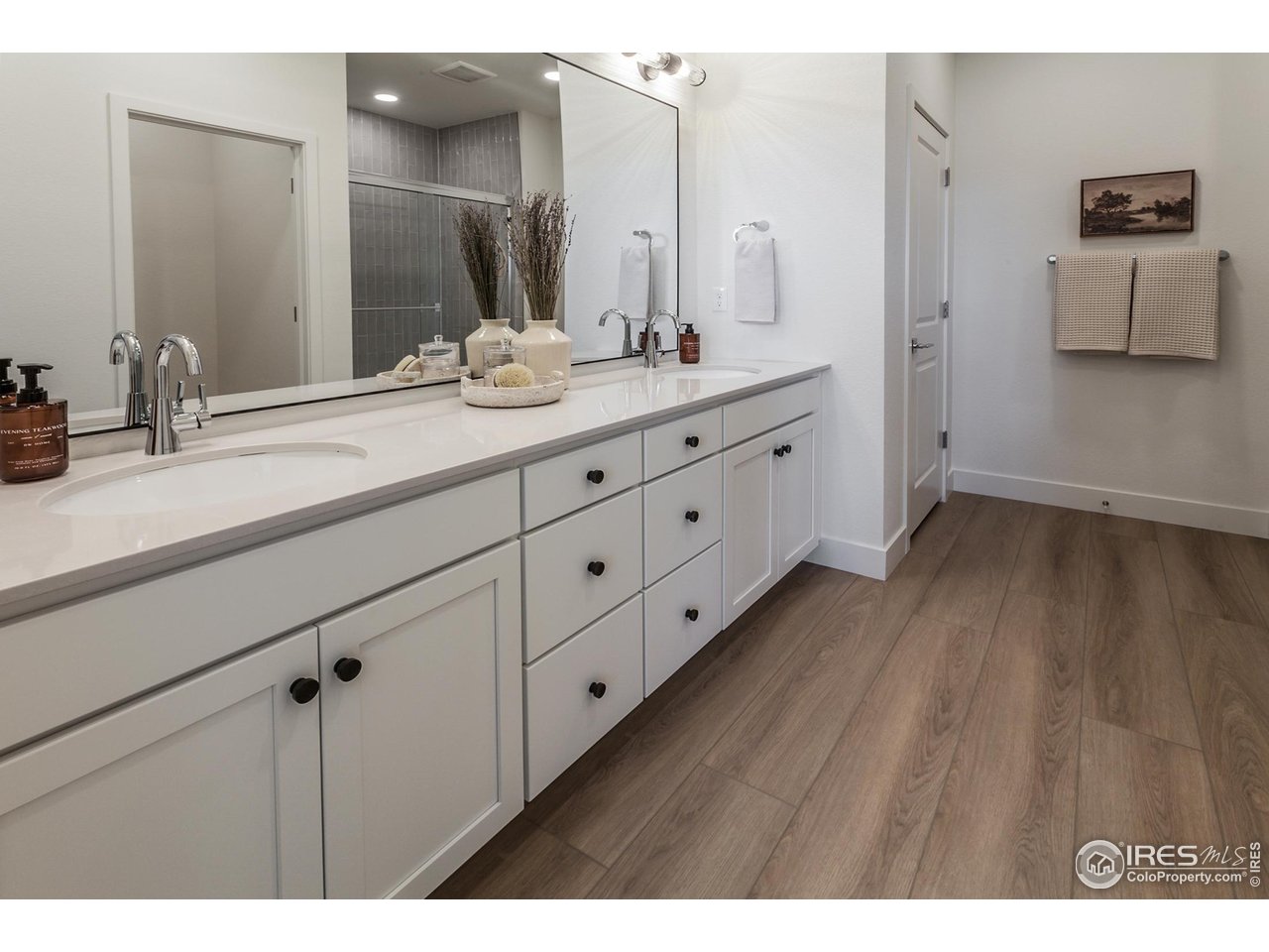 792 Chatter Road Windsor, CO 80550 - Photo 27 of 42 a bathroom with a double vanity sink and mirror