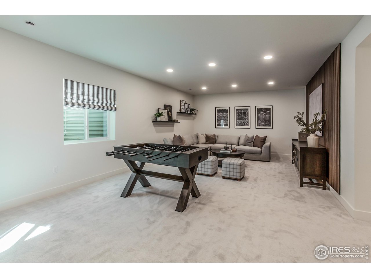 792 Chatter Road Windsor, CO 80550 - Photo 30 of 42 a living room with furniture and a window