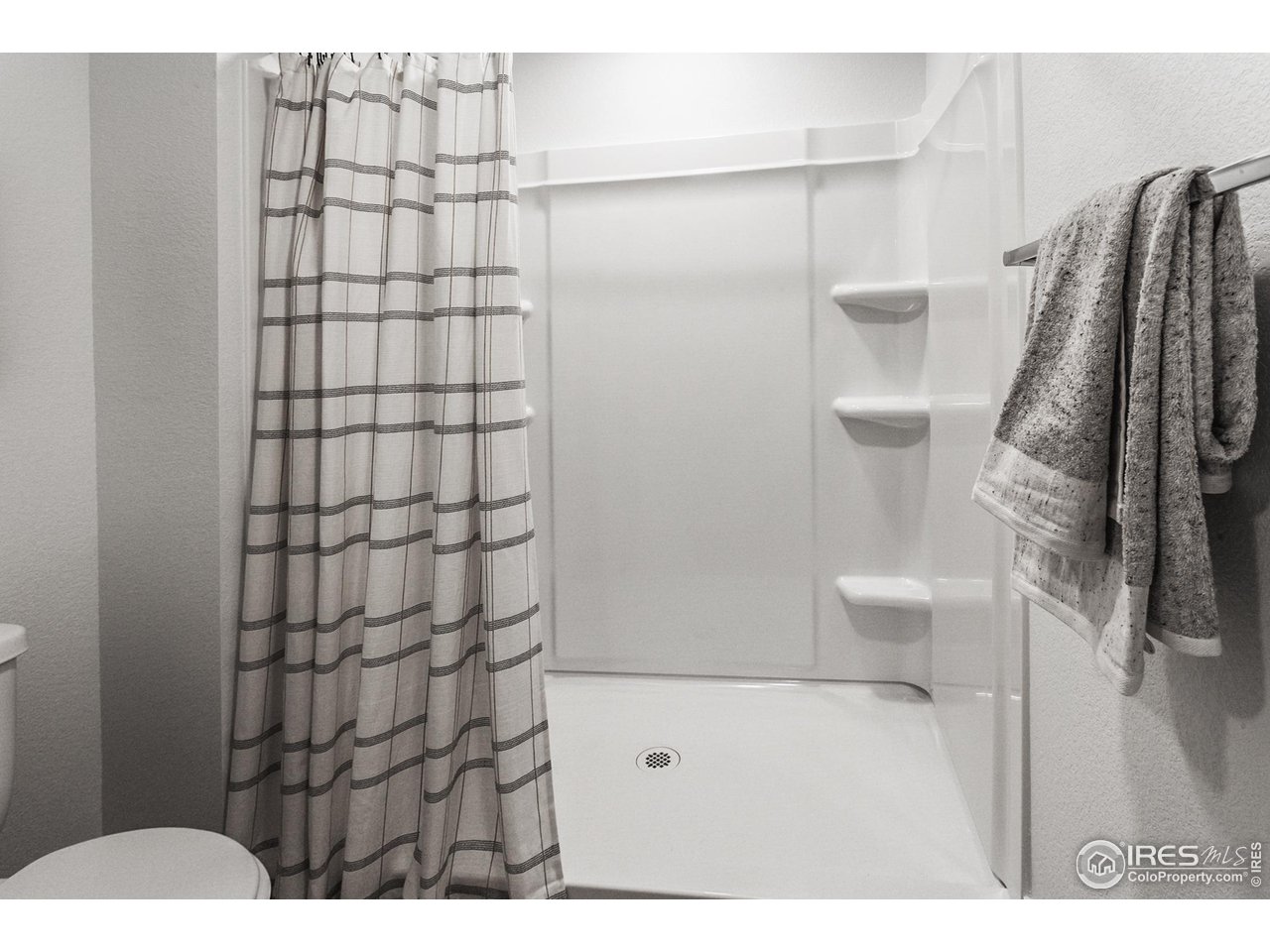 792 Chatter Road Windsor, CO 80550 - Photo 35 of 42 a bathroom with a shower toilet and sink