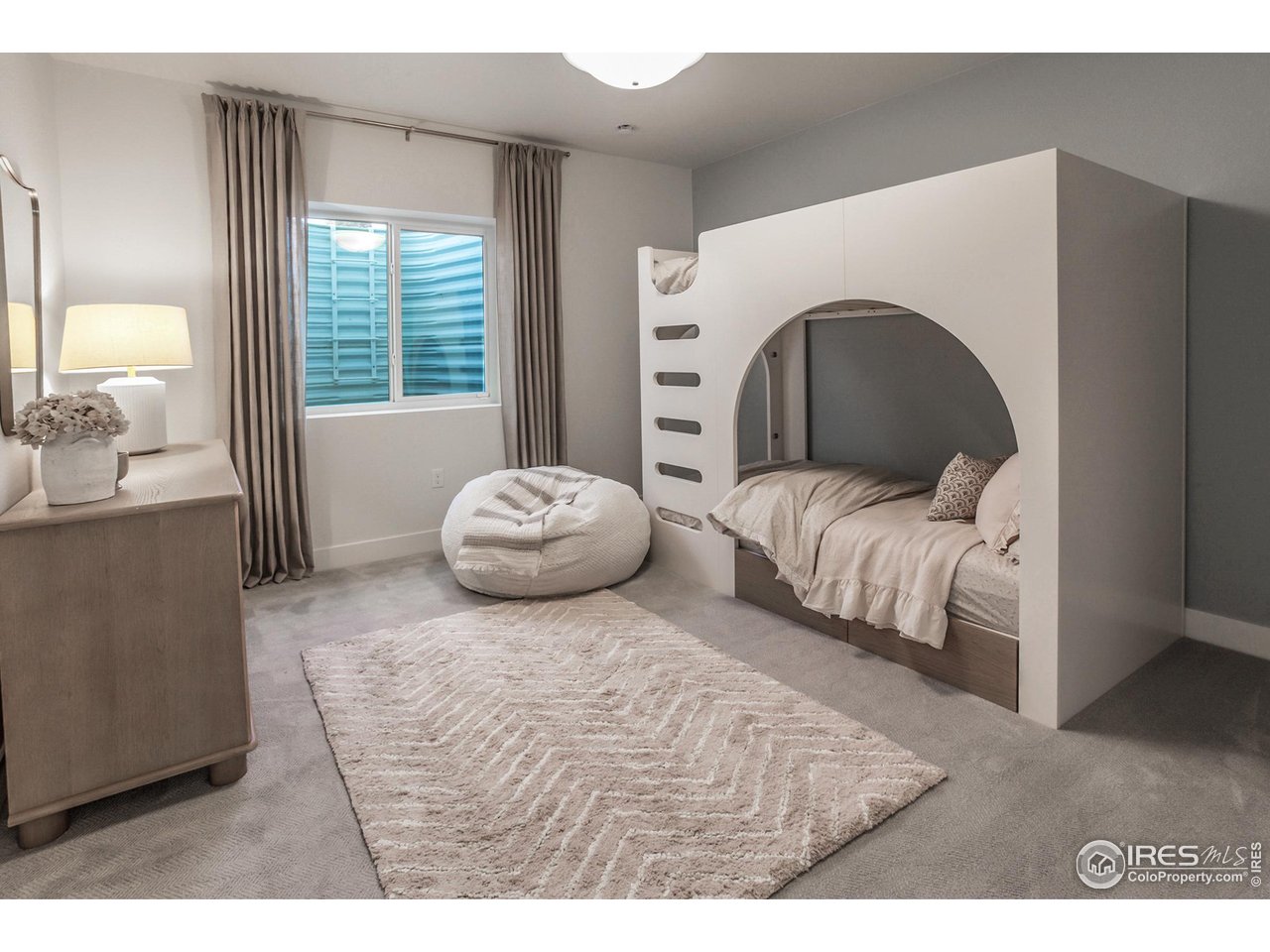 792 Chatter Road Windsor, CO 80550 - Photo 38 of 42 a bedroom with a bed and a large window
