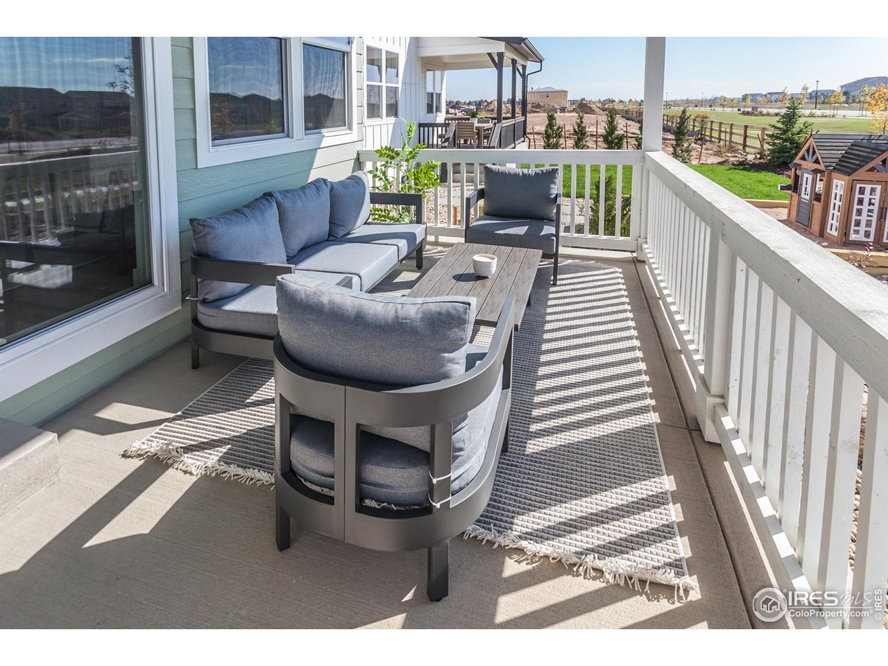 792 Chatter Road Windsor, CO 80550 - Photo 39 of 42 a view of balcony with seating space and city view