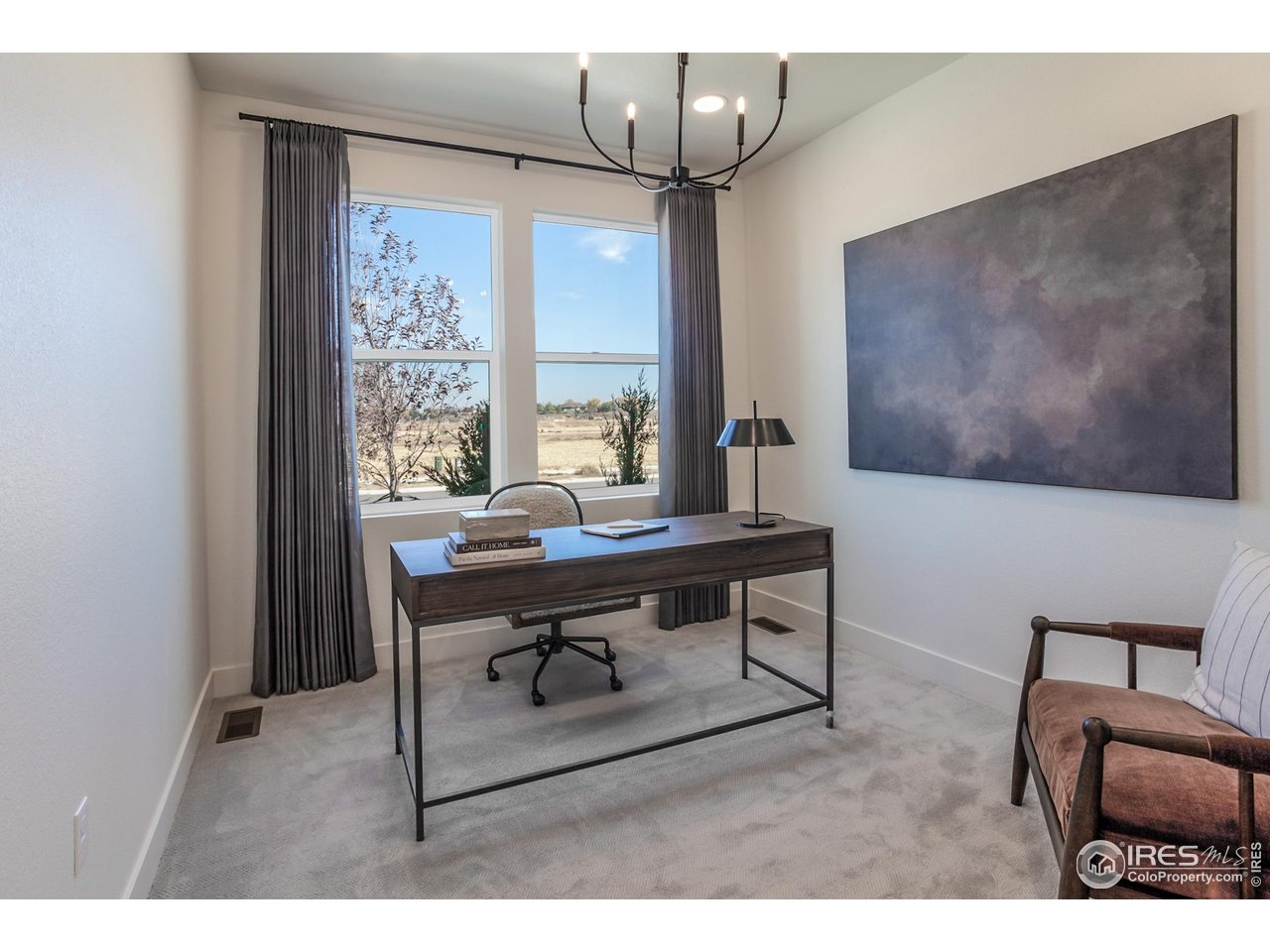 792 Chatter Road Windsor, CO 80550 - Photo 4 of 42 a view of a livingroom with furniture and window