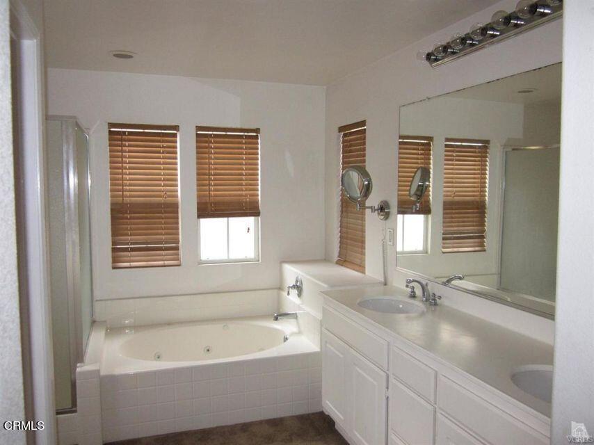 1731 Sonata Drive Oxnard, CA 93030 - Photo 12 of 13 a bathroom with a tub a sink and a window