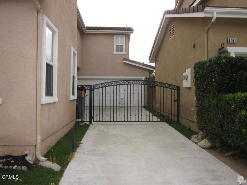 1731 Sonata Drive Oxnard, CA 93030 - Photo 2 of 13 a view of a street with a house