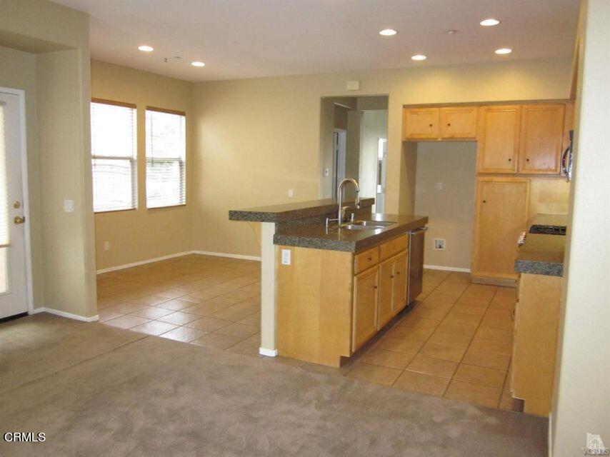 1731 Sonata Drive Oxnard, CA 93030 - Photo 6 of 13 a bathroom with a double vanity sink and a mirror