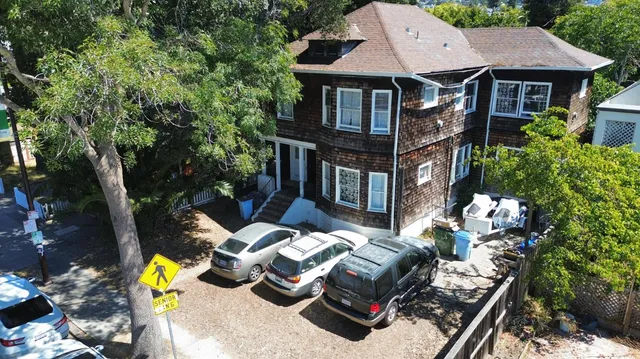 a view of house with outdoor space and sitting area