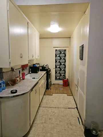 a bathroom with a tub toilet and sink