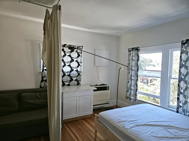 a bathroom with a tub a sink and a shower