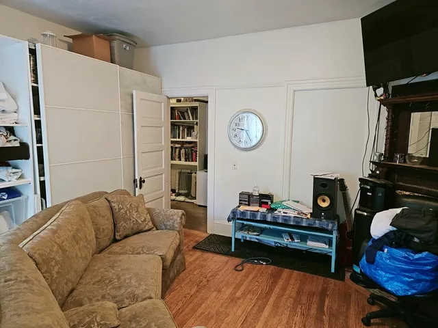 a bathroom with a sink and mirror with toilet