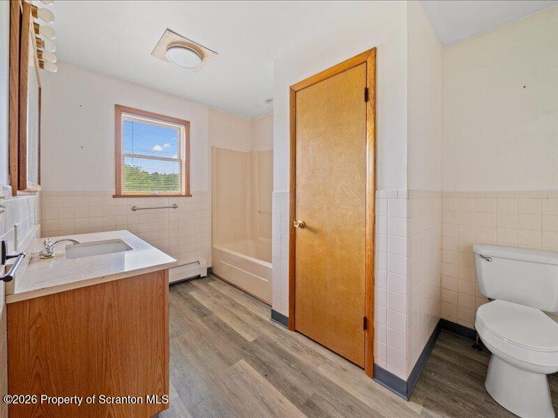 9-17 Vago Road Tunkhannock, PA 18657 - Photo 20 of 57 a bathroom with a sink toilet and vanity