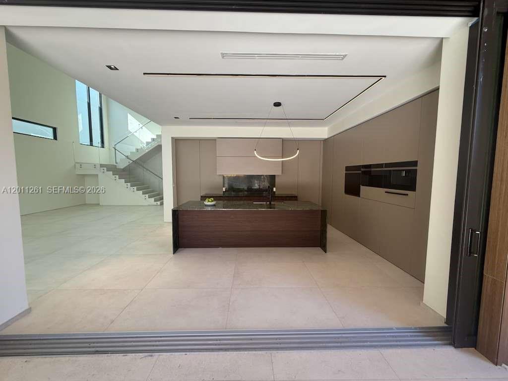 135 Southwest 29th Road Miami, FL 33129 - Photo 17 of 47 a view of kitchen and refrigerator