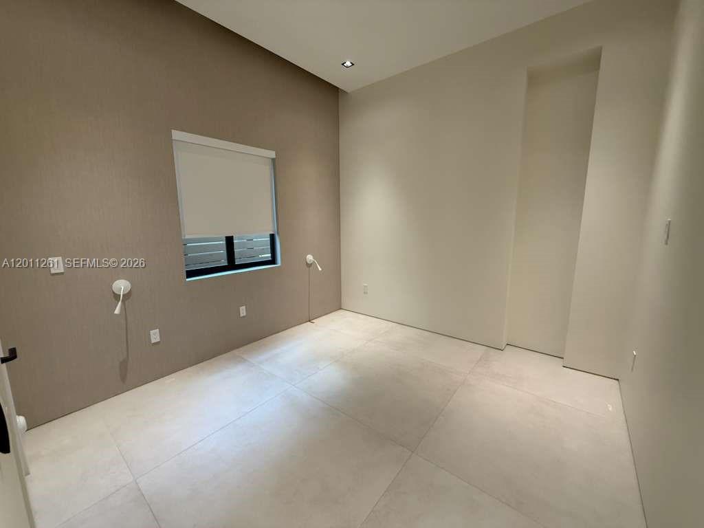 135 Southwest 29th Road Miami, FL 33129 - Photo 35 of 47 a view of a room with a projector and stairs