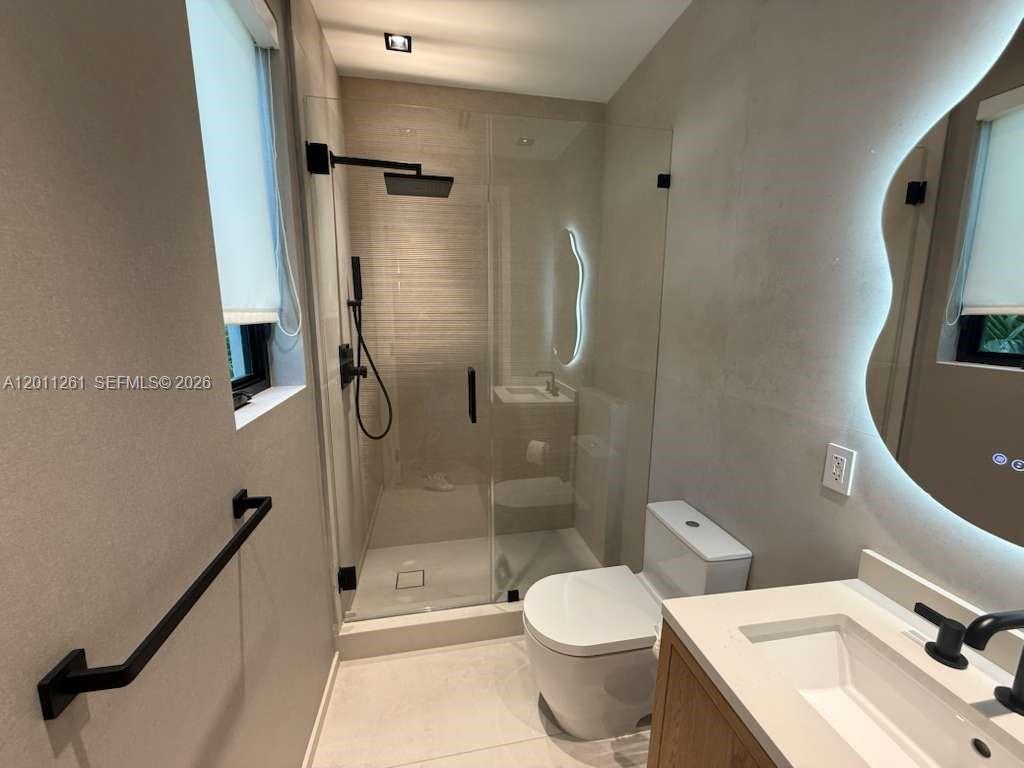 135 Southwest 29th Road Miami, FL 33129 - Photo 42 of 47 a bathroom with a sink toilet and shower