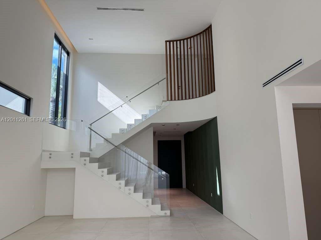 135 Southwest 29th Road Miami, FL 33129 - Photo 8 of 47 a view of entryway and hall with wooden floor