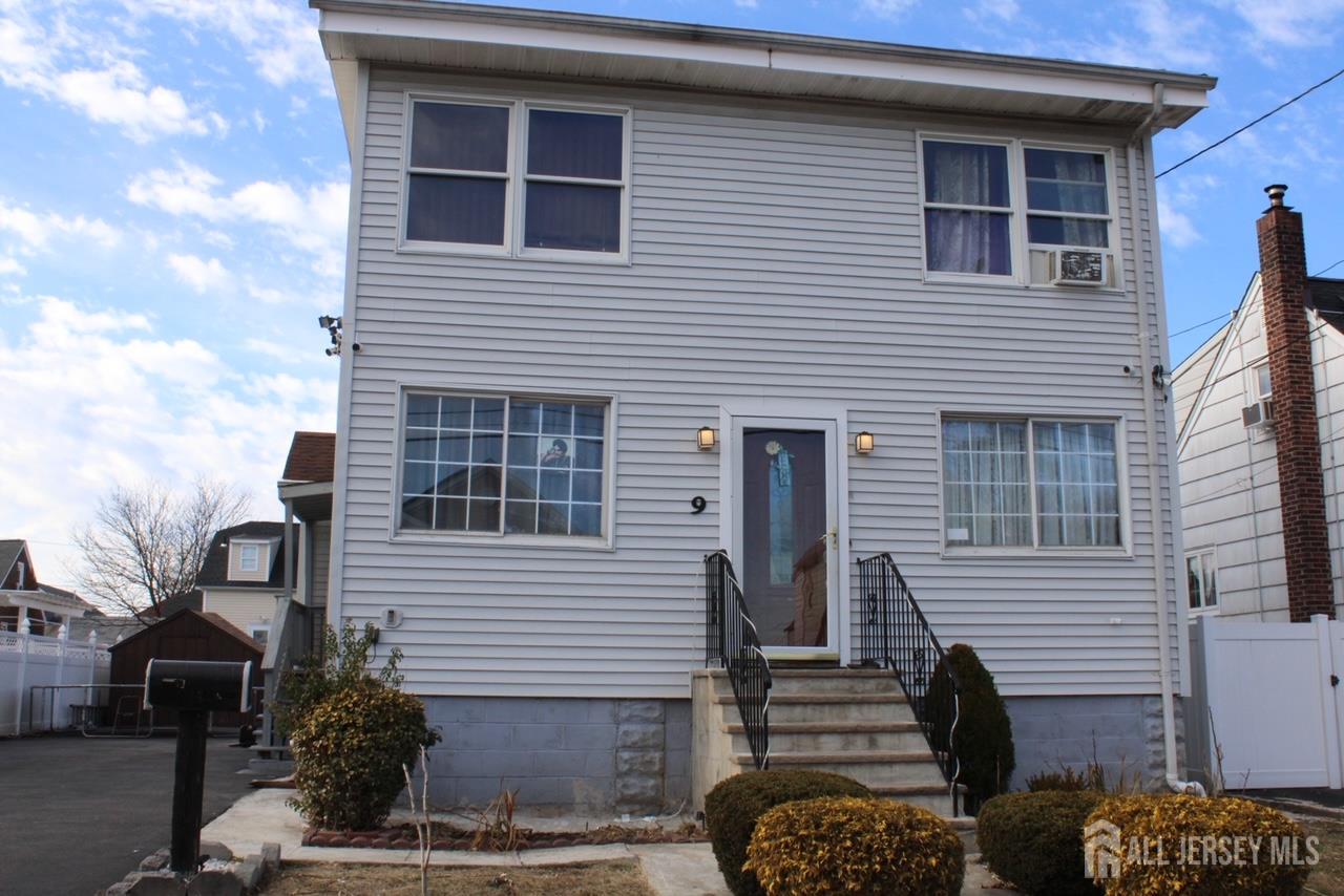 9 Hermann Street Carteret, NJ 07008 - Photo 3 of 23 a front view of a house with parking space
