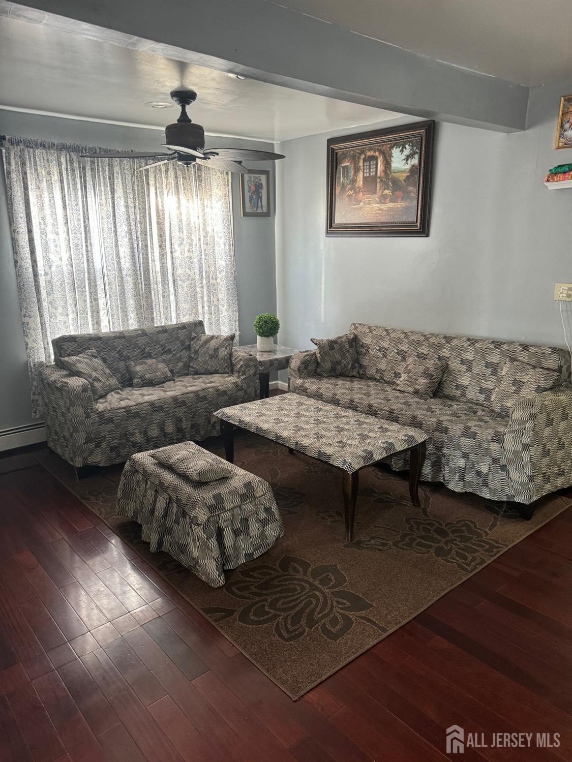 9 Hermann Street Carteret, NJ 07008 - Photo 8 of 23 a living room with furniture and a large window