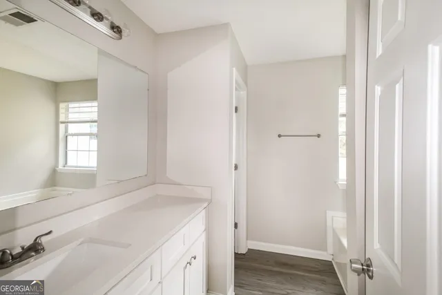 a room with a sink and a mirror