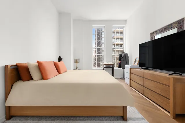 a kitchen with stainless steel appliances granite countertop a sink and a refrigerator