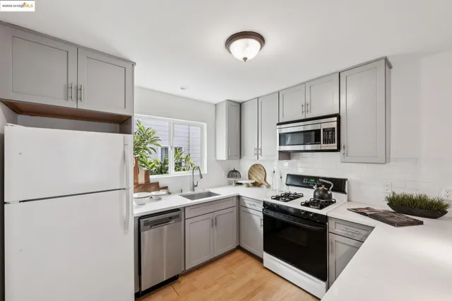 a kitchen with a refrigerator stove and microwave