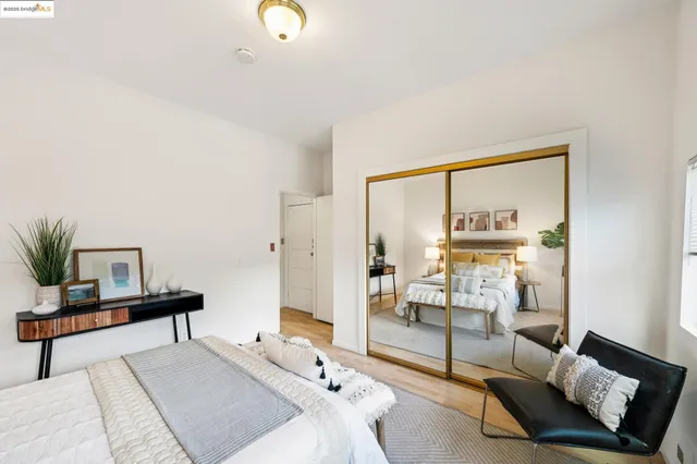 a bedroom with furniture and a window